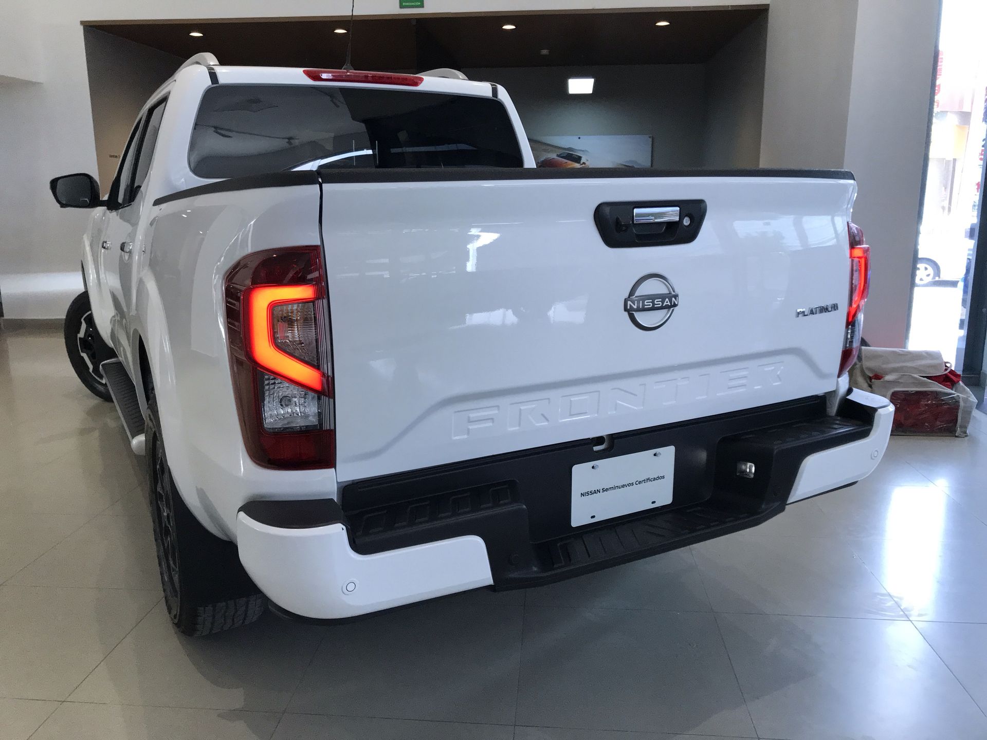 2023 Nissan FRONTIER PLATINUM LE TA 23